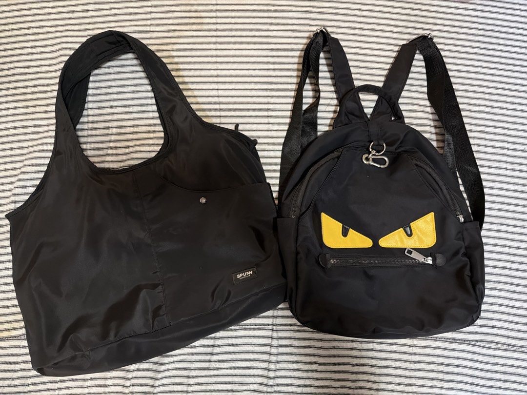 (Take all) Black Backpack & Black Nylon Tote Bag (Category: Tote Bags) located in Manila. Submitted by mondaymom (Listing ID 1462984788, Image 1). Description: - Black backpack with fun monster eye design - Multiple zippers and adjustable straps on backpack - Includes a black tote bag with a pocket - Tote bag features a snap closure - Both bags made of nylon material - Ideal for everyday use or travel.