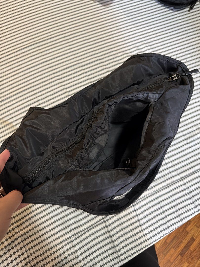 (Take all) Black Backpack & Black Nylon Tote Bag (Category: Tote Bags) located in Manila. Submitted by mondaymom (Listing ID 1462984788, Image 3). Description: - Black backpack with fun monster eye design - Multiple zippers and adjustable straps on backpack - Includes a black tote bag with a pocket - Tote bag features a snap closure - Both bags made of nylon material - Ideal for everyday use or travel.