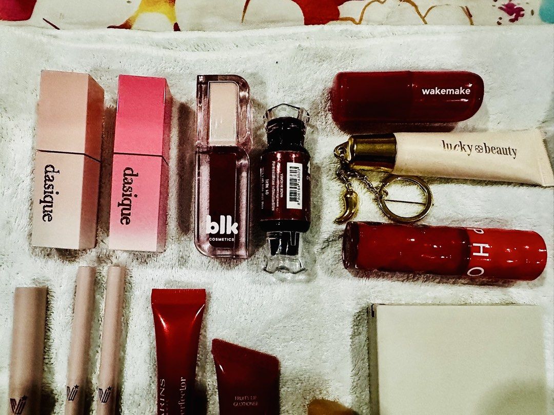TAKE ALL! Eyes, Lips, Face Bundle (Category: Makeup) located in Pasig City. Submitted by clubjungwoo (Listing ID 1463004688, Image 2). Description: - Makeup Bundle Deal! - Includes: Dasique lipsticks, BLK lip gloss, Laka lip tint, Clarins lip perfector, Sephora lipstick, Wakemake lipstick, Lucky Beauty, and Horus eyeliner. - Variety of lip products, cream, and eyeliner. - Condition: Some items are brand new, others are lightly used. - Great value