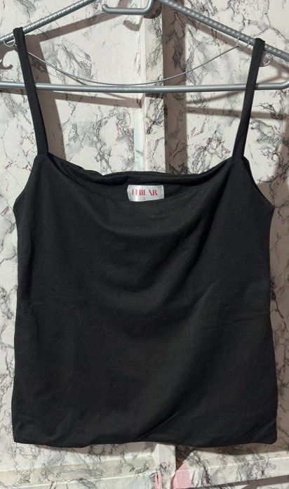 Tank Tops (Category: Sleeveless) located in Manila. Submitted by kirayychii (Listing ID 1463107395, Image 3). Description: - Take all for ₱140 - Assorted Tank Tops - Good condition.