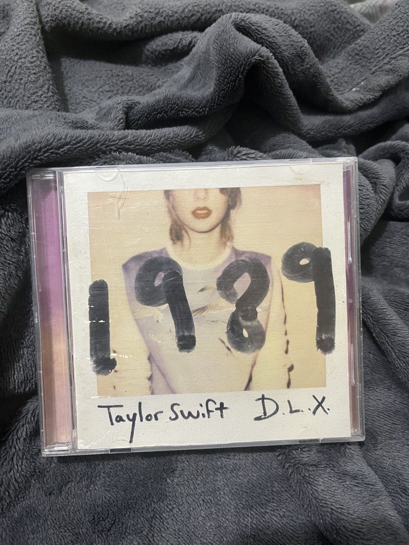 Taylor Swift 1989 Deluxe Edition CD (Category: CDs & DVDs) located in Cebu City. Submitted by santisanta66891 (Listing ID 1463060605, Image 2). Description: - Taylor Swift's 1989 Deluxe Edition CD - Includes bonus tracks and exclusive photos - Essential for any Taylor Swift fan's collection - Own a piece of this iconic album.