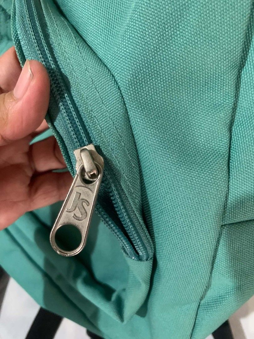Teal Jansport Half Pint Mini Backpack (Category: Backpacks) located in Cagayan de Oro. Submitted by nadittelop78337 (Listing ID 1462895196, Image 3). Description: - Cute teal Jansport Half Pint mini backpack - Front zippered pocket - Main compartment - 'JS' branded zippers - Comes with attached keychain - Ideal for carrying essentials.