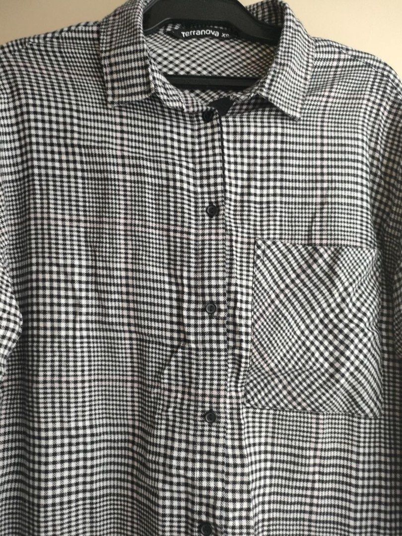 Terranova Plaid Long Sleeve Shirt (Category: Longsleeves) located in Rizal. Submitted by cjloveph (Listing ID 1462952329, Image 3). Description: - Terranova long sleeve shirt - Classic black and white plaid pattern - Button-up front with a chest pocket - Side slits for a relaxed fit - Perfect for layering or wearing on its own - Comfortable and versatile.