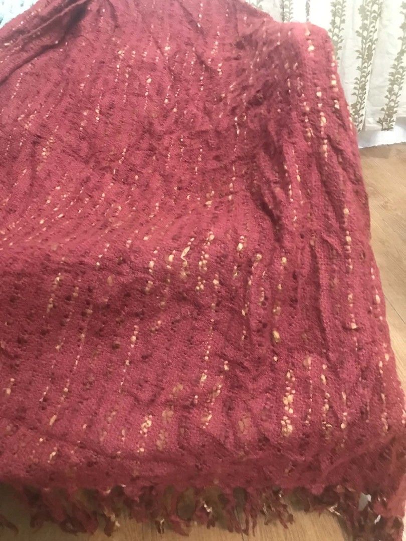 Textured Maroon Throw Blanket with Fringe (Category: Bedding & Towels) located in Imus. Submitted by stop_shop7 (Listing ID 1462954880, Image 2). Description: - Cozy textured throw blanket - Deep maroon color - Lovely fringe detail on both ends - Subtle flecks of gold or tan thread throughout - Adds warmth and style to your sofa or bed .