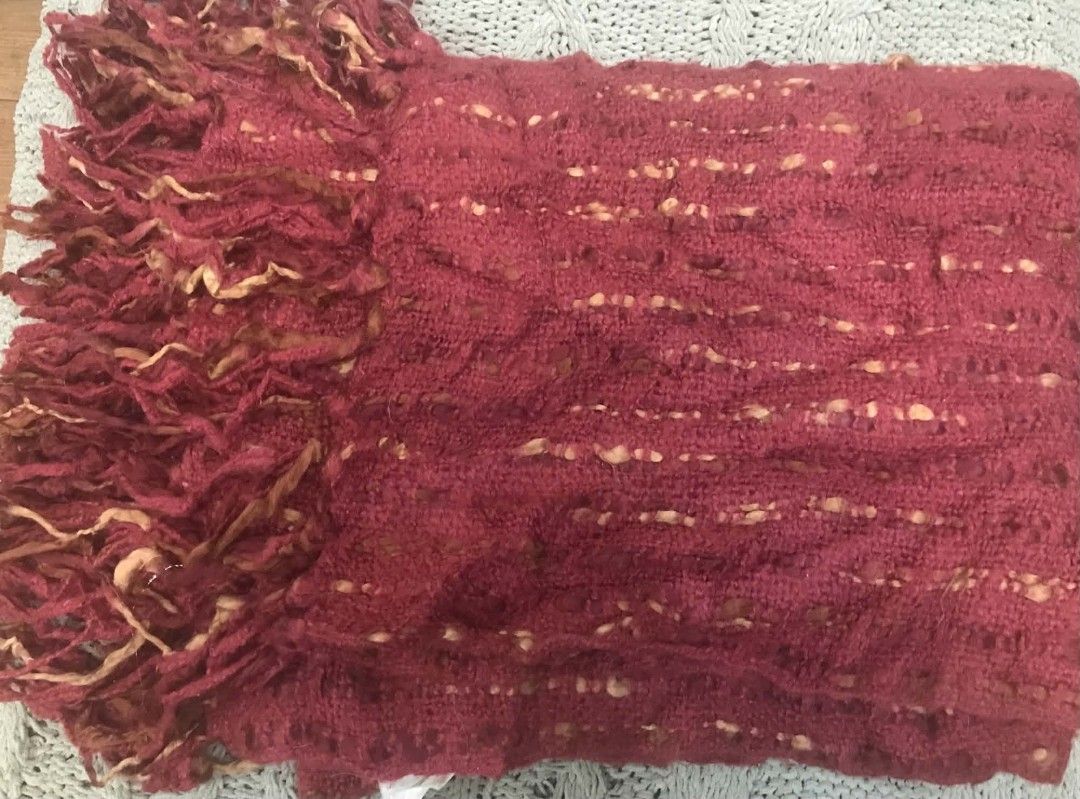 Textured Maroon Throw Blanket with Fringe (Category: Bedding & Towels) located in Imus. Submitted by stop_shop7 (Listing ID 1462954880, Image 3). Description: - Cozy textured throw blanket - Deep maroon color - Lovely fringe detail on both ends - Subtle flecks of gold or tan thread throughout - Adds warmth and style to your sofa or bed .