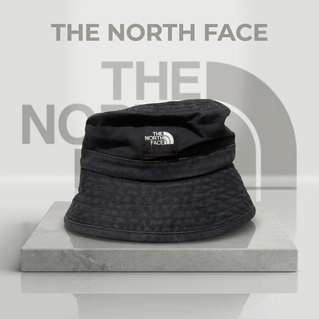 The North Face Black Bucket Hat (Category: Caps & Hats) located in Carmen. Submitted by rr_thrifts (Listing ID 1462952305, Image 1). Description: - Classic black bucket hat - Brand: The North Face - Material: Durable fabric - Versatile design for sunny days or streetwear - Fits most head sizes - Essential wardrobe accessory.