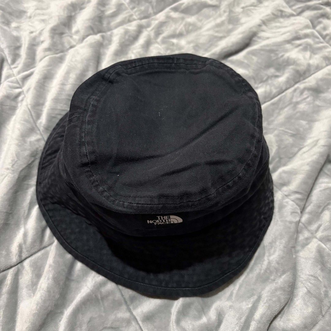 The North Face Black Bucket Hat (Category: Caps & Hats) located in Manila. Submitted by abj_thriftshop (Listing ID 1463006582, Image 2). Description: - Classic black bucket hat from The North Face - Made from durable material - Features the iconic TNF logo on the front - Comfortable fit for everyday wear - Great for sunny days or adding a streetwear vibe - Easy to pack and take anywhere.