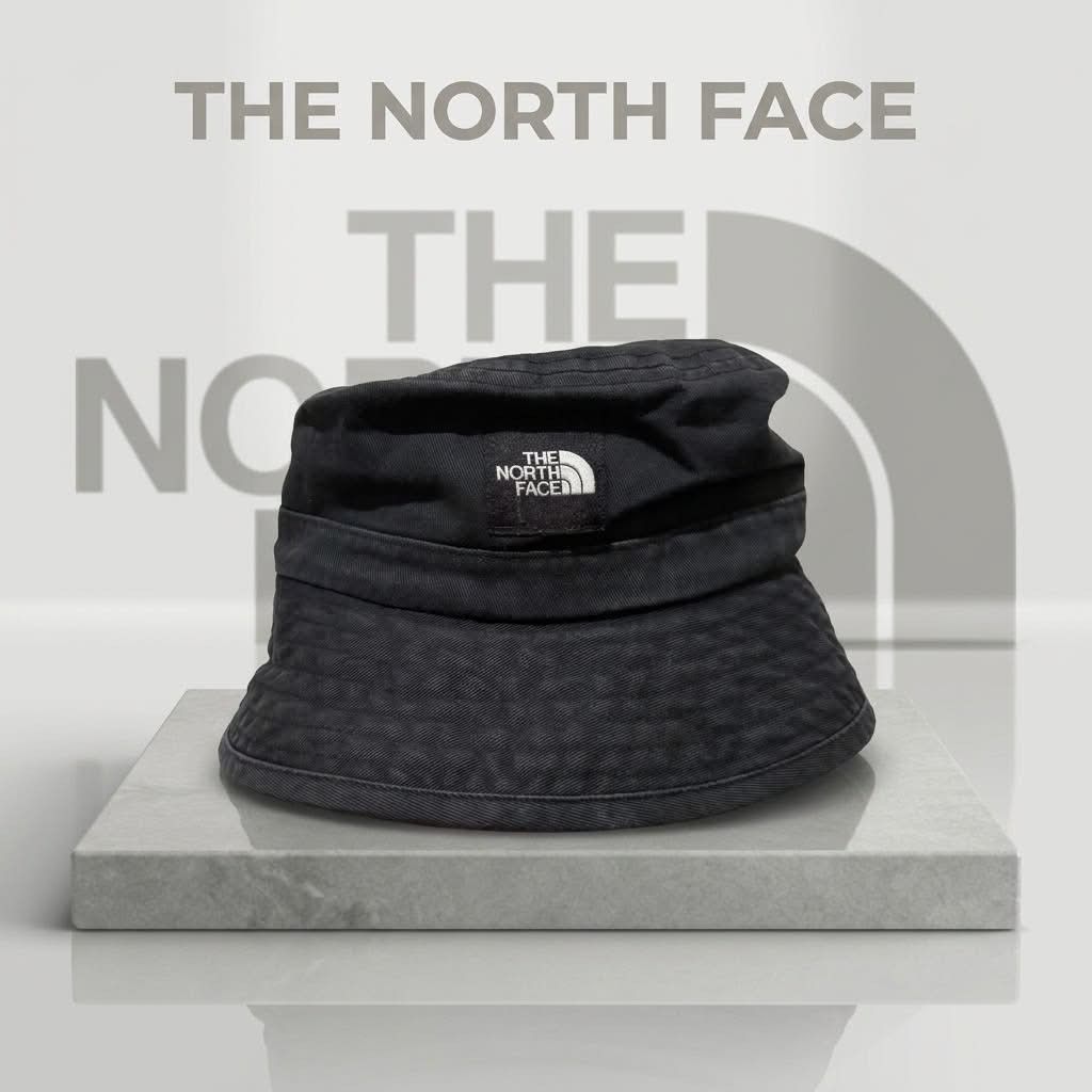 The North Face Black Bucket Hat (Category: Caps & Hats) located in Manila. Submitted by abj_thriftshop (Listing ID 1463006582, Image 1). Description: - Classic black bucket hat from The North Face - Made from durable material - Features the iconic TNF logo on the front - Comfortable fit for everyday wear - Great for sunny days or adding a streetwear vibe - Easy to pack and take anywhere.