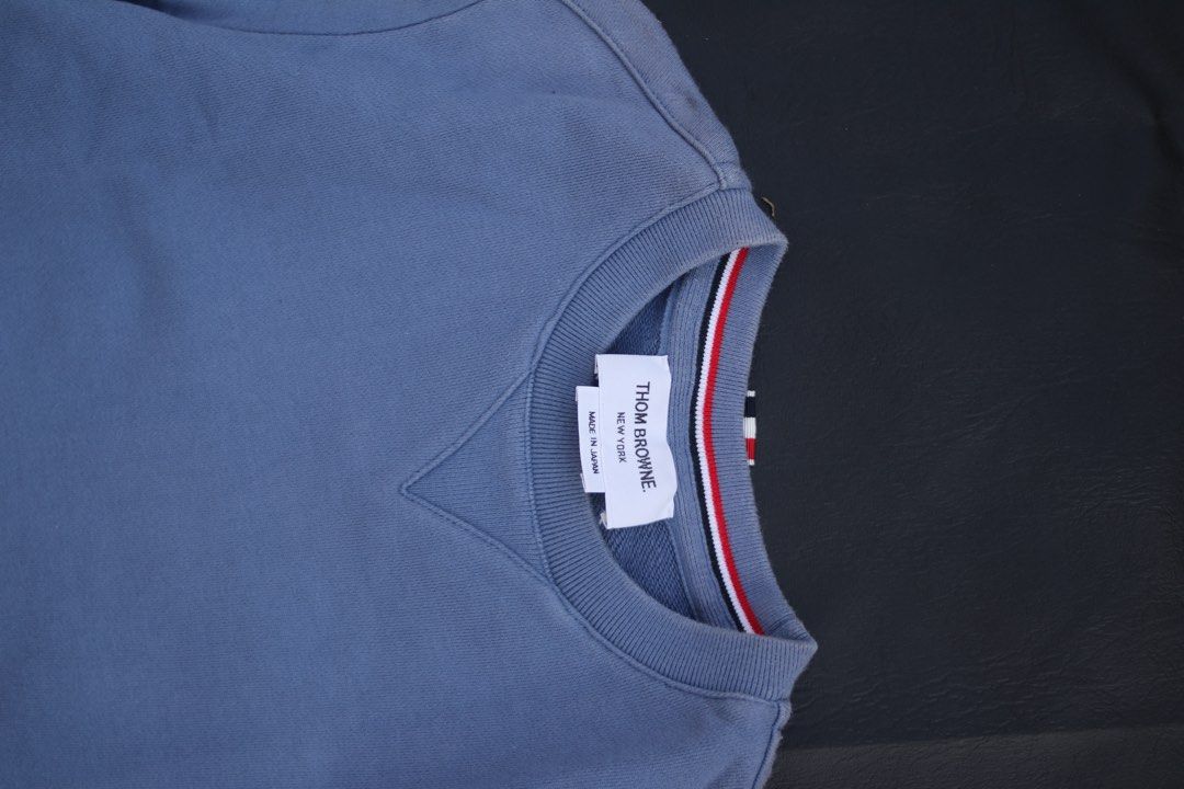 Thom Browne Blue Sweatshirt with White Shirt Layer (Category: Luxury Apparel) located in Taguig. Submitted by kurim4w (Listing ID 1463002809, Image 3). Description: - Blue sweatshirt with integrated white shirt layer - Iconic Thom Browne four-stripe detail on sleeve -fading in shoulder - Made in Japan - Tag size: 40 - Ideal for creating stylish layered outfits - Crafted from comfortable cotton material 17.5width 27length 550php only plus sf tagui