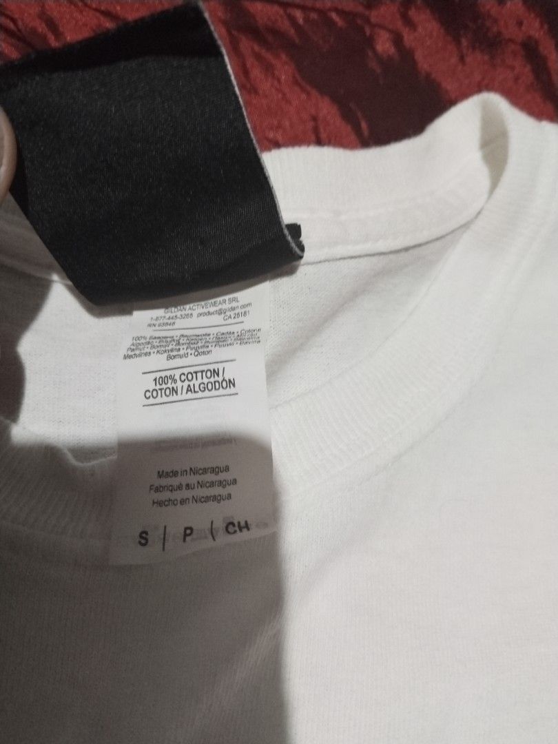 Thrasher White Tee (Category: Tshirts & Polo Shirts ) located in Mabalacat. Submitted by al_amin_thrift (Listing ID 1463028976, Image 3). Description: - Brand: Thrasher — Iconic Skateboarding Magazine ​ - Origin: San Francisco, USA ​ - Color: White with Classic Yellow/Orange Flame Logo ​ - Size: S (P/CH) — Standard Small ​ - Fabric: 100% Cotton — soft & durable ​ - Made in: Nicaragua ​ - Design: "Thrasher" flame lettering + "MAGAZINE" underline ​
