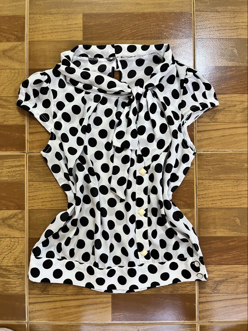 Thrifted Polka Dot Blouse with Bow Tie Neck (Category: Blouses) located in Sorsogon. Submitted by onthedailly (Listing ID 1461009299, Image 1). Description: Cute white blouse with black polka dots and a neck bow tie. Short sleeves, button-up front with yellow buttons. mop: gcash/maribank courier: j&t loc: sor city (bicol).