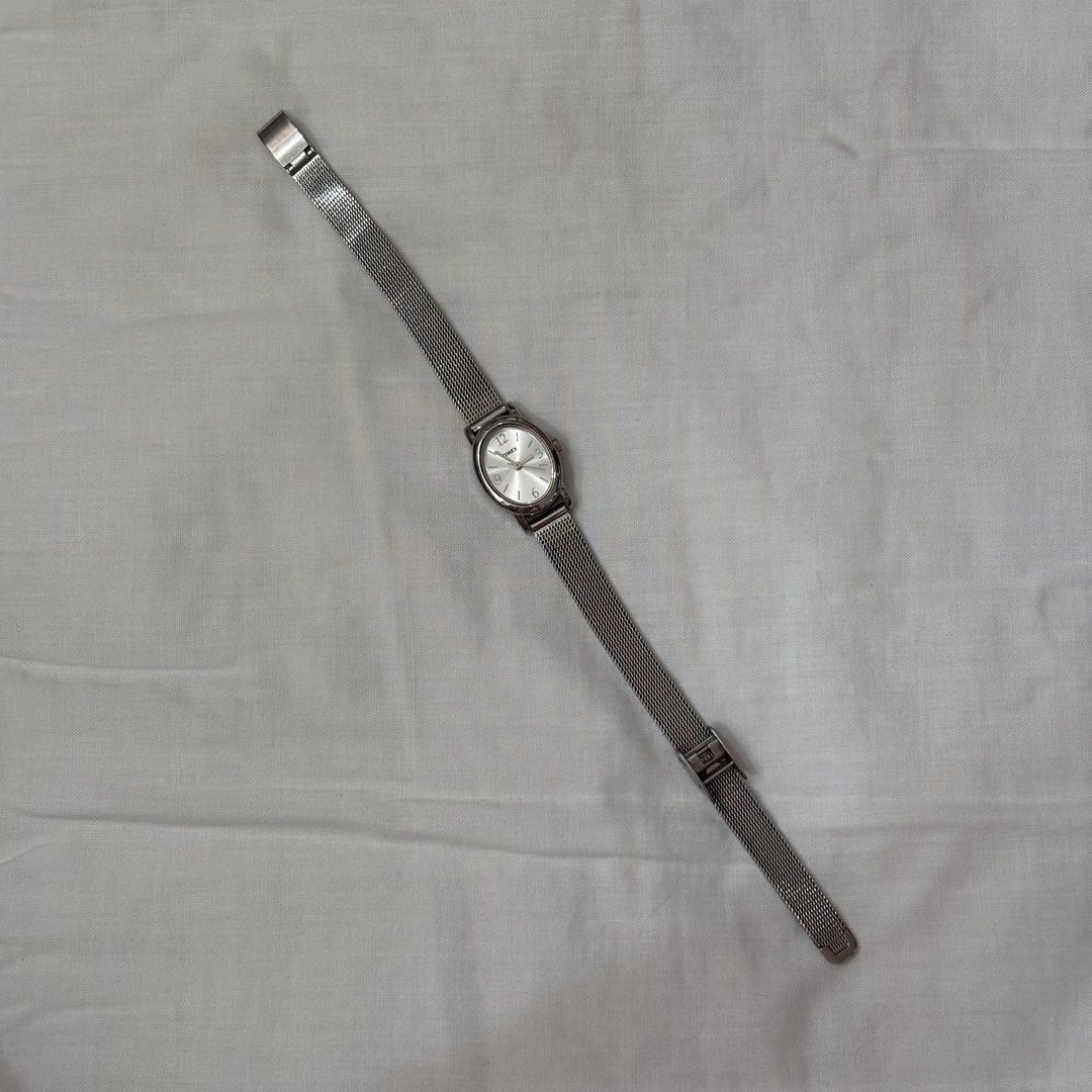 Timex Silver Mesh Band Oval Face Watch (Category: Women's Watches) located in Makati City. Submitted by manicfaerydream (Listing ID 1462926613, Image 2). Description: - Timex watch with a sleek silver mesh band. - Features an elegant oval face with a clean, minimalist dial. - Adjustable band ensures a comfortable and personalized fit. - Simple, classic design perfect for everyday wear..