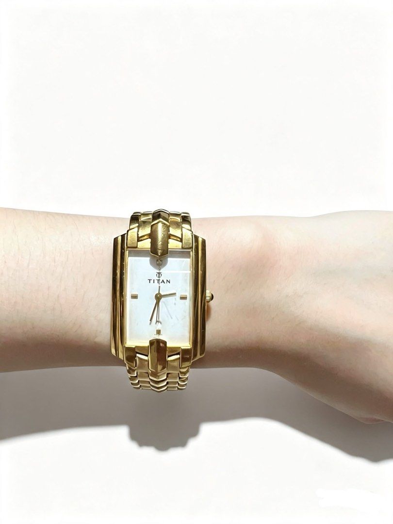 Titan Gold Rectangle Watch (Category: Women's Watches) located in Manila. Submitted by joshuahonggg (Listing ID 1462948130, Image 1). Description: Titan gold-tone rectangular dress watch Classic slim design, quartz, gold plated stainless steel Clean, working well, and like new. Issue: No box Only ₱3,500 Original Retail Price: ₱6,500.
