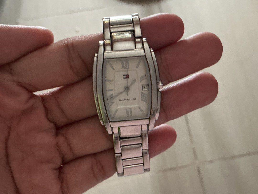 Tommy Hilfiger Silver Tone Rectangle Watch (Category: Women's Watches) located in Quezon City. Submitted by matchaluu (Listing ID 1462952709, Image 2). Description: Not sure if working, Original all parts Php. 500 MOP: GCASH/ BANK TRANSFER MOD: JNT .
