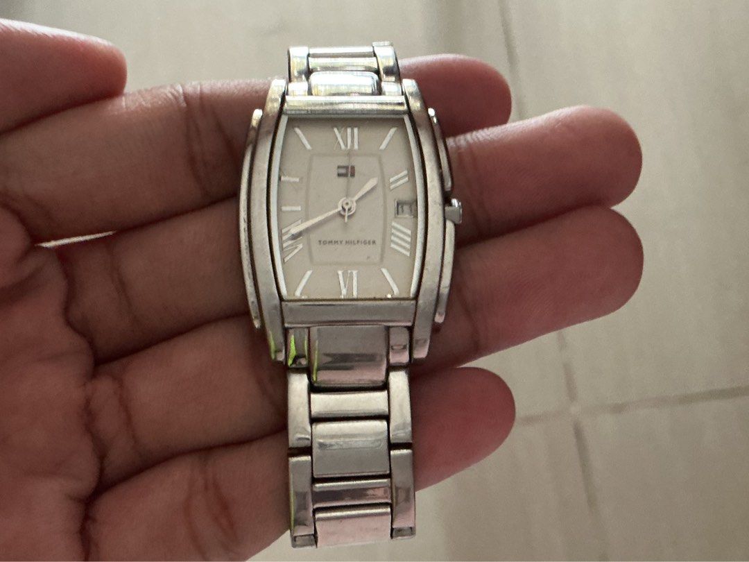 Tommy Hilfiger Silver Tone Rectangle Watch (Category: Women's Watches) located in Quezon City. Submitted by matchaluu (Listing ID 1462952709, Image 1). Description: Not sure if working, Original all parts Php. 500 MOP: GCASH/ BANK TRANSFER MOD: JNT .