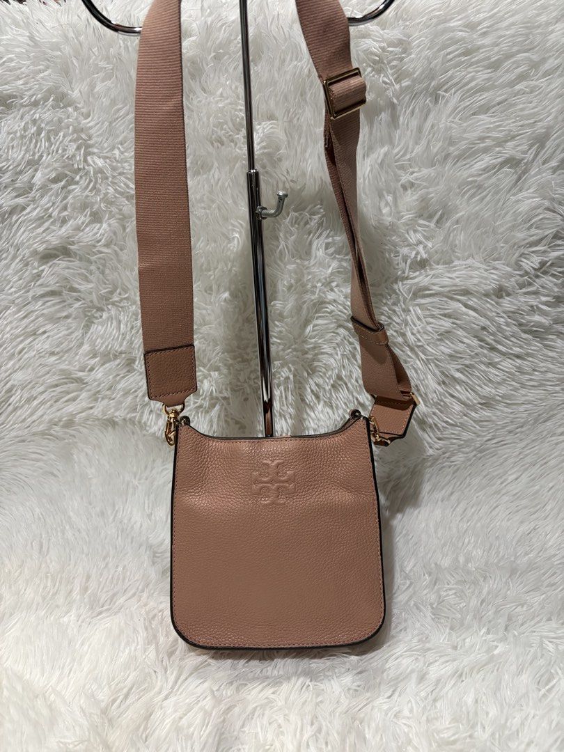 Tory burch (Category: Luxury Bags & Wallets) located in Baguio. Submitted by rheaanne07 (Listing ID 1462885708, Image 2). Description: Tory burch thea mini web shoulder bag in soft pink moon shade Missing tassle Pero pretty pa din Like new Orig.