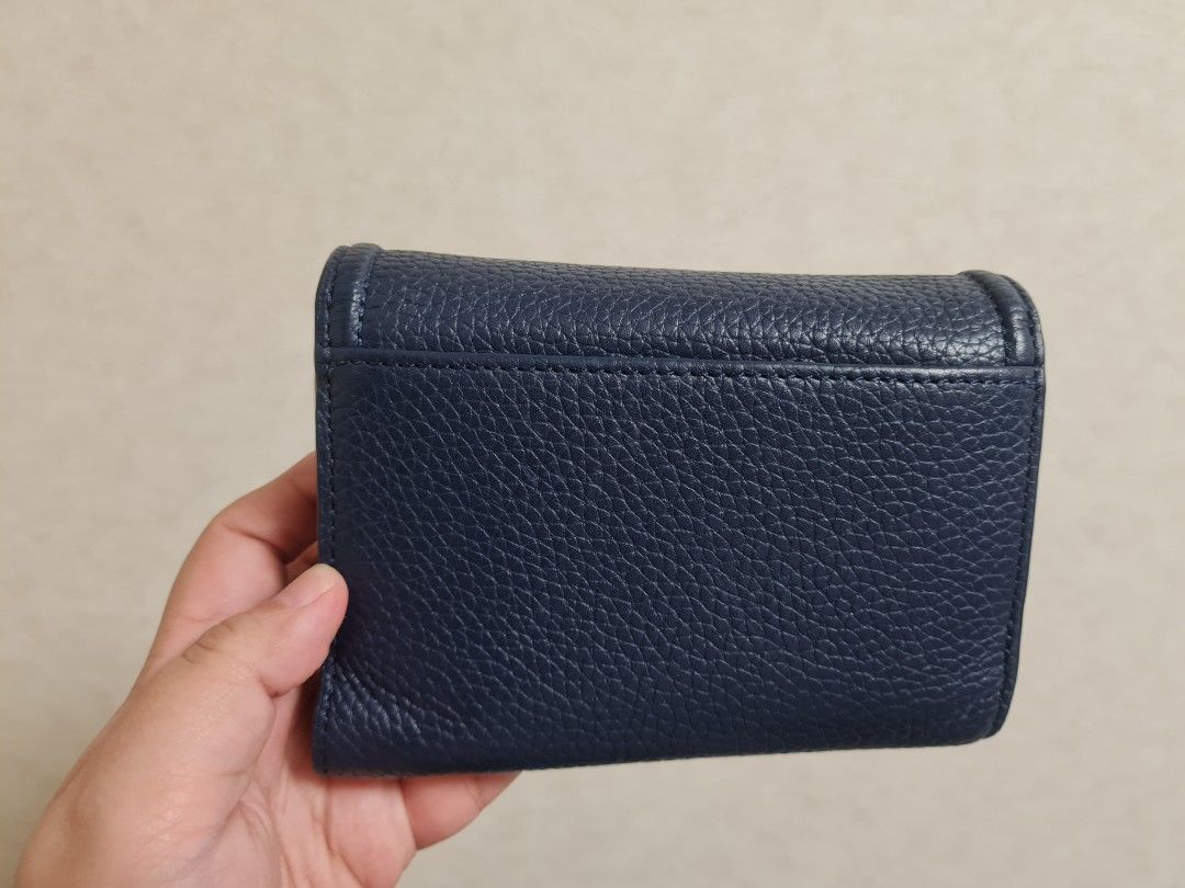 Tory Burch Wallet (Category: Wallets & Card holders) located in Dasmarinas. Submitted by ramyeong (Listing ID 1462916570, Image 2). Description: Tory Burch Wallet Bought in outlet (can't remember if in US or Japan) I will try to find a small TB paper bag May have a mild stored smell due to long-term storage.