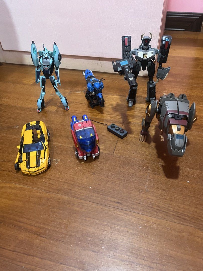 Transformers Action Figures - Bumblebee, Grimlock, and more (Category: Action & Battle Toys) located in Antipolo. Submitted by babalou316 (Listing ID 1462940130, Image 1). Description: - Collection of Transformers action figures, take all - Bumblebee (missing left arm, hard joints) - Grimlock (missing left dinosaur arm, no sword) - Shockwave (missing chin piece, missing left leg cover piece) - Blurr (missing hood piece) - Optimus Prime Cybertroni