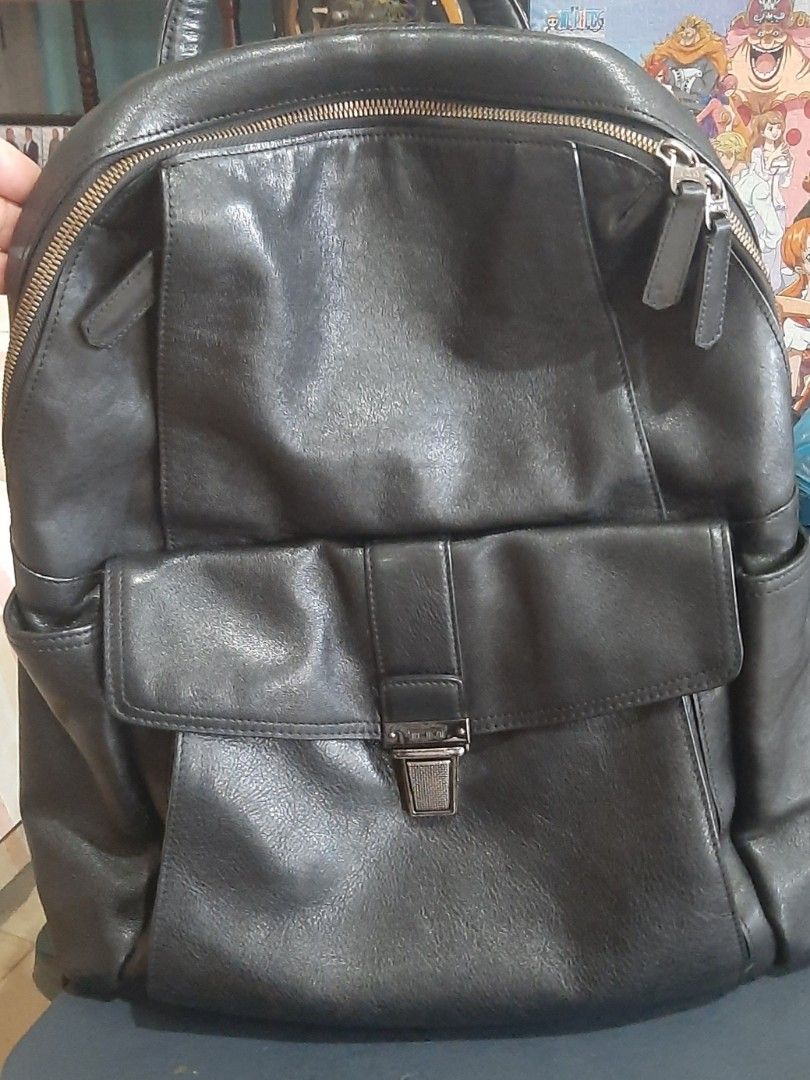 Tumi Beacon Hill Brimmer Black Leather Backpack (Category: Luxury Bags & Wallets) located in Orion. Submitted by atgalacio (Listing ID 1462934362, Image 1). Description: Tumi Beacon Hill Brimmer Leather Backpack (specifically style/model number 68580D). This is a premium, full-grain pebbled leather business backpack from Tumi's discontinued Beacon Hill collection. It features a classic vintage look, a distinctive signature metallic push-button cl
