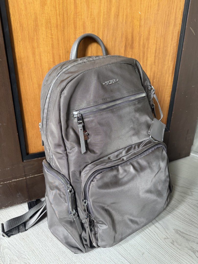 Tumi Voyageur Carson Backpack (Category: Backpacks) located in Manila. Submitted by atbp_seller (Listing ID 1462893032, Image 1). Description: Tumi Voyageur Carson Backpack Color: Zinc (Grey) Material: Lightweight, Premium Nylon with leather trim Dimensions: 16.9in x 12in x 5.5in Weight: 0.7kg Has many pockets, side pockets to fit your tumbler, dedicated laptop compartment, etc. RFS: Upgrade. Bag is in super good condition PHP 18,500 only .