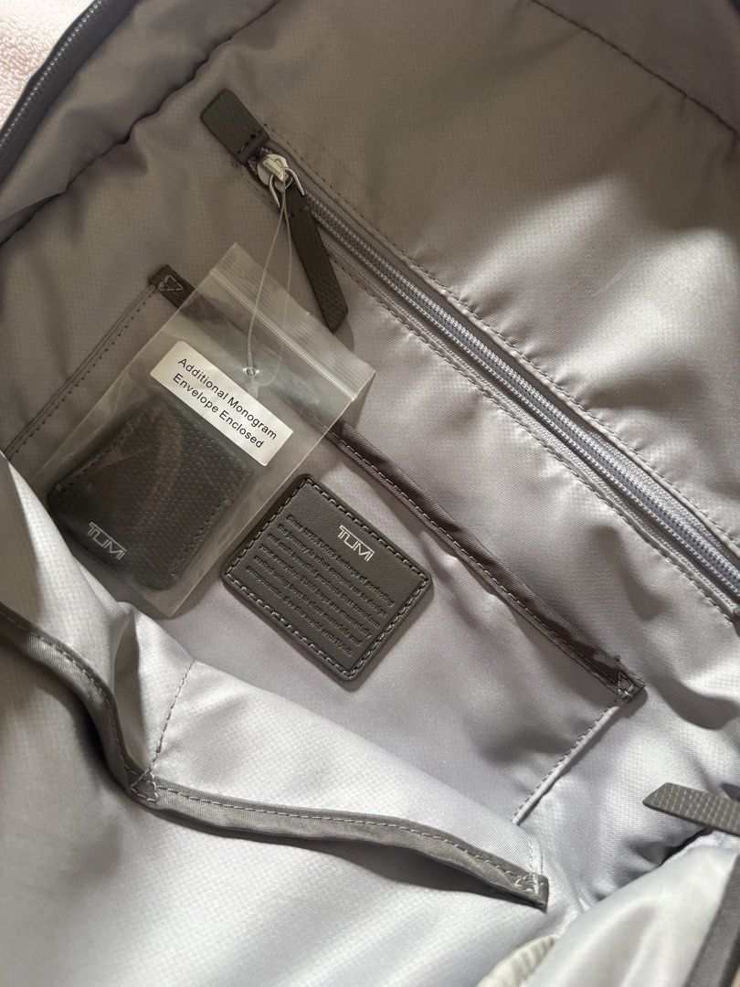 Tumi Voyageur Carson Backpack (Category: Backpacks) located in Manila. Submitted by atbp_seller (Listing ID 1462893032, Image 3). Description: Tumi Voyageur Carson Backpack Color: Zinc (Grey) Material: Lightweight, Premium Nylon with leather trim Dimensions: 16.9in x 12in x 5.5in Weight: 0.7kg Has many pockets, side pockets to fit your tumbler, dedicated laptop compartment, etc. RFS: Upgrade. Bag is in super good condition PHP 18,500 only .
