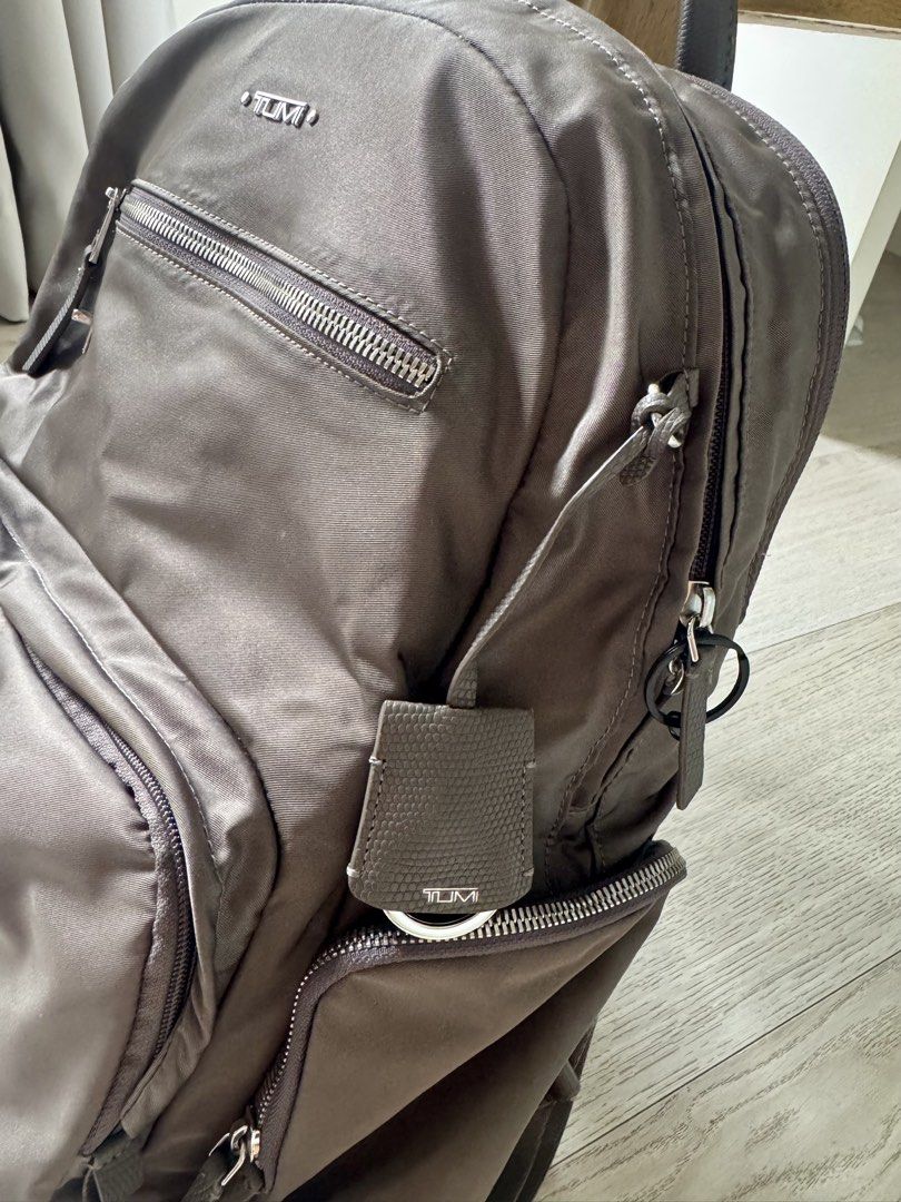 Tumi Voyageur Carson Backpack (Category: Backpacks) located in Manila. Submitted by atbp_seller (Listing ID 1462893032, Image 2). Description: Tumi Voyageur Carson Backpack Color: Zinc (Grey) Material: Lightweight, Premium Nylon with leather trim Dimensions: 16.9in x 12in x 5.5in Weight: 0.7kg Has many pockets, side pockets to fit your tumbler, dedicated laptop compartment, etc. RFS: Upgrade. Bag is in super good condition PHP 18,500 only .