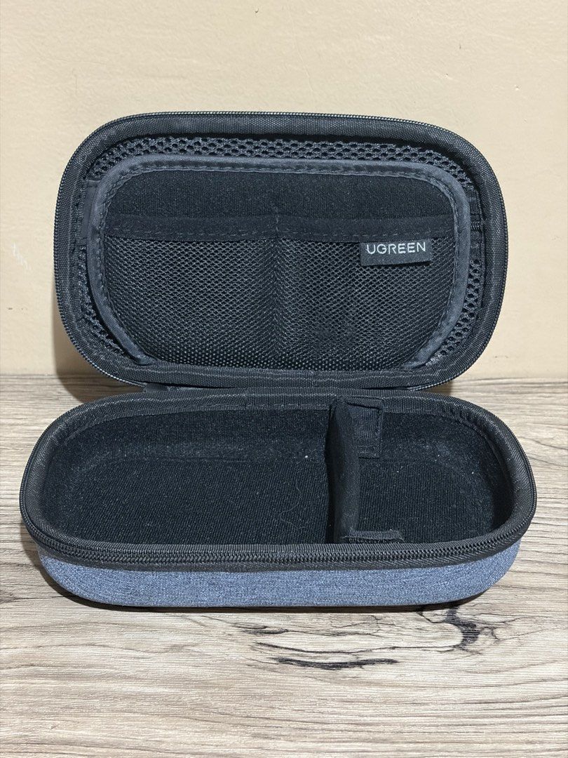 UGREEN Multi-function Storage Case - Grey (Category: Cases & Sleeves) located in Pasig City. Submitted by bitsoutdoor (Listing ID 1462941307, Image 2). Description: - UGREEN Storage Case - Stylish Grey Fabric Exterior - Secure Zipper Closure - Interior Mesh Pocket for organization - Elastic Strap to keep items in place - Ideal for Cables, Chargers, and Small Electronics - Compact and Perfect for Travel - Smoothly working zippers - Like new. .