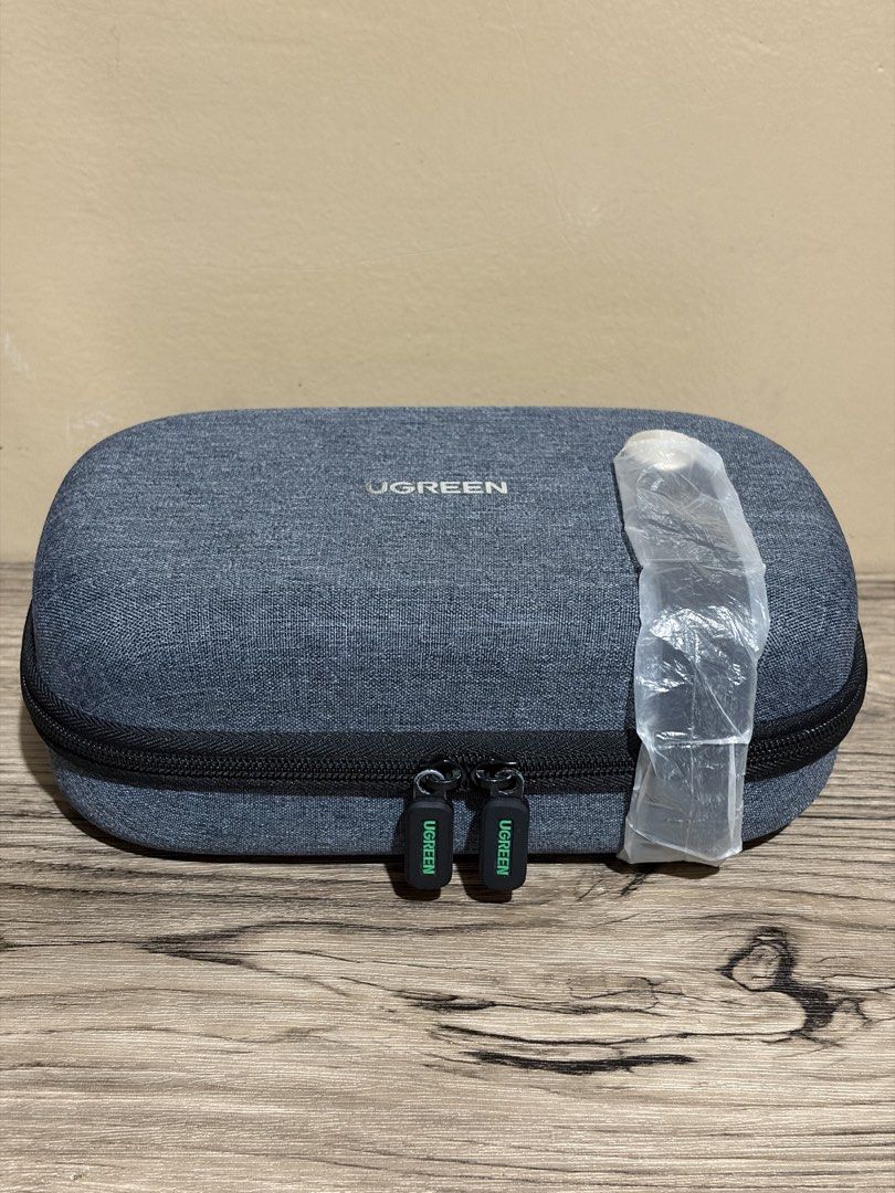 UGREEN Multi-function Storage Case - Grey (Category: Cases & Sleeves) located in Pasig City. Submitted by bitsoutdoor (Listing ID 1462941307, Image 1). Description: - UGREEN Storage Case - Stylish Grey Fabric Exterior - Secure Zipper Closure - Interior Mesh Pocket for organization - Elastic Strap to keep items in place - Ideal for Cables, Chargers, and Small Electronics - Compact and Perfect for Travel - Smoothly working zippers - Like new. .