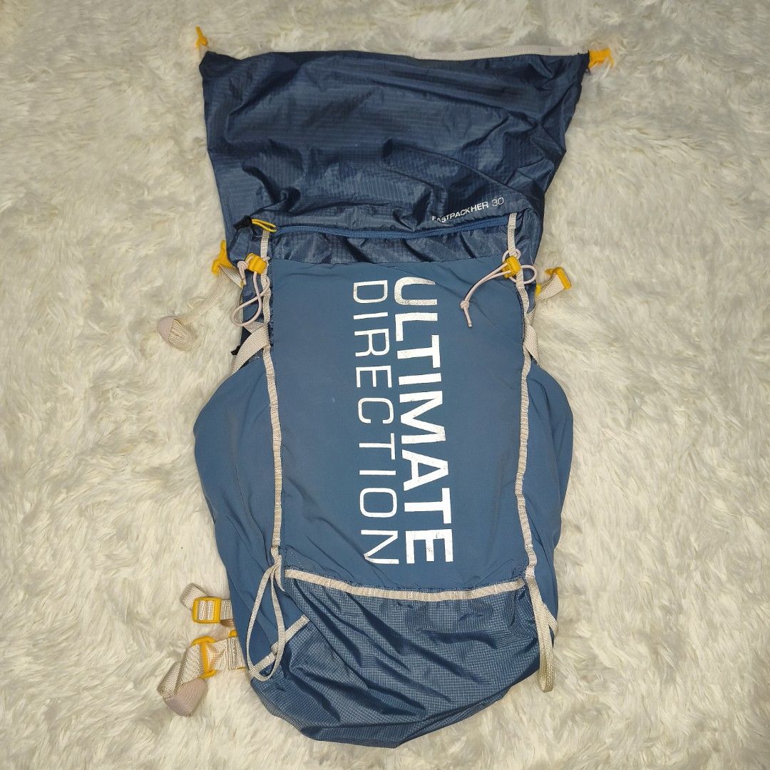 Ultimate Direction Ultralight 30L Backpack (Category: Hiking & Camping) located in Antipolo. Submitted by alphaomega_fox (Listing ID 1462895649, Image 1). Description: Ultimate Direction Fastpackher 30L backpack. Lightweight design, weighs only 608g. Great for hiking and trail running. Multiple pockets and adjustable straps for a comfortable fit. Blue color with yellow accents. Main compartment is spacious. Good for day trips or overnight adventu