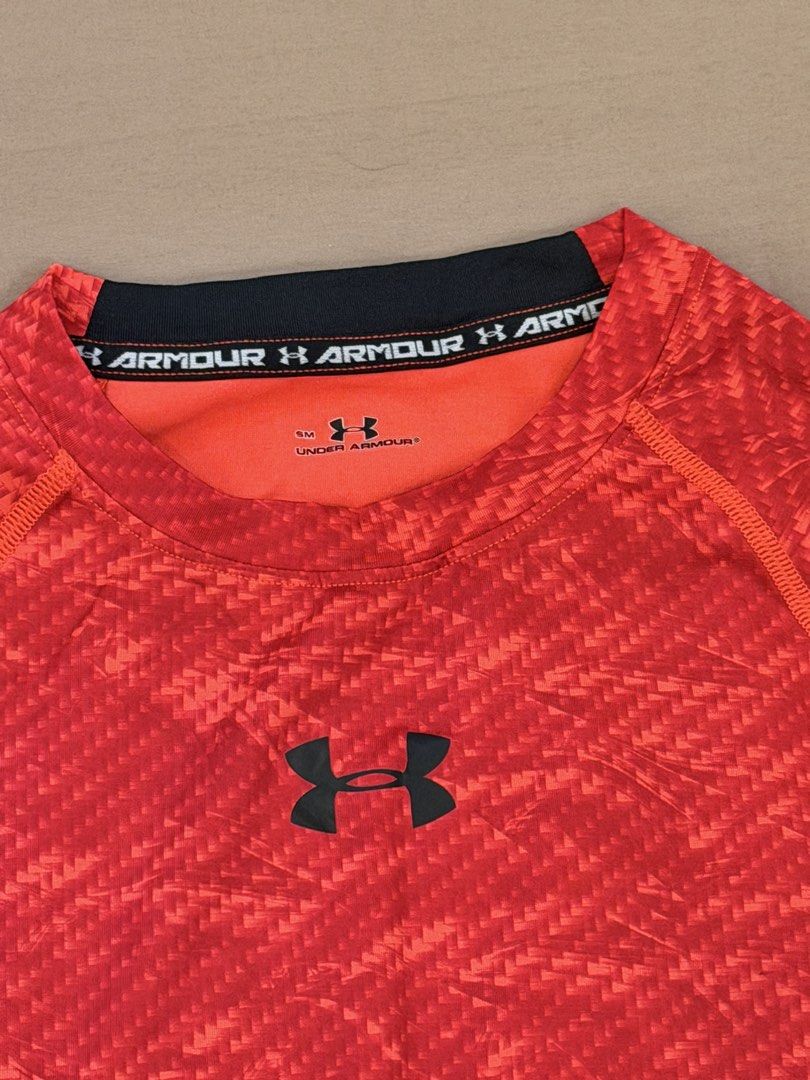 Under Armour Red Patterned Long Sleeve Compression Shirt SM (Category: Activewear) located in Bulacan. Submitted by preloved_bygrace (Listing ID 1462983250, Image 3). Description: - Brand: Under Armour - Color: Red with cool pattern - Accents: Black on sides and collar - Size: SM - Features: Signature performance fabric, UA logo on chest and sleeve Note: Color may vary due to lighting. RFS: decluttering, need funds *Buyer shoulders the SF (J&T or
