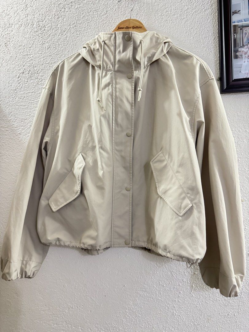 Uniqlo Beige Hooded Jacket with Drawstring (Category: Coats, Jackets and Outerwear) located in Manila. Submitted by janelica220598 (Listing ID 1462896729, Image 1). Description: USED ONCE ONLY BOUGHT FOR 2999 - Lightweight beige jacket - Features a hood with drawstring - Button-up front closure - Two front pockets - Drawstring at the hem - Ideal for casual outings and layering.
