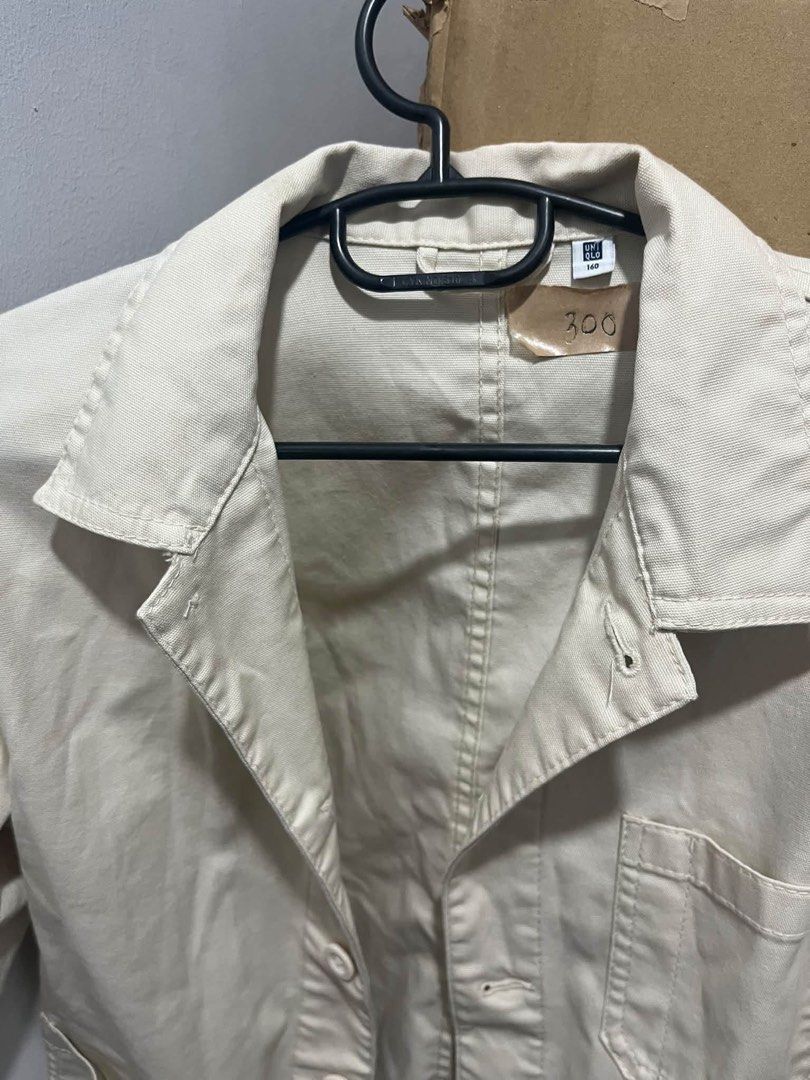 Uniqlo Beige Work Jacket (Category: Coats, Jackets and Outerwear) located in Quezon City. Submitted by decluttercollection01 (Listing ID 1463076309, Image 2). Description: - Uniqlo work jacket in a versatile beige color. - Classic collar and button-up front. - Features two chest pockets and two lower pockets. - Ideal for layering and creating casual outfits. - Selling for PHP 300..