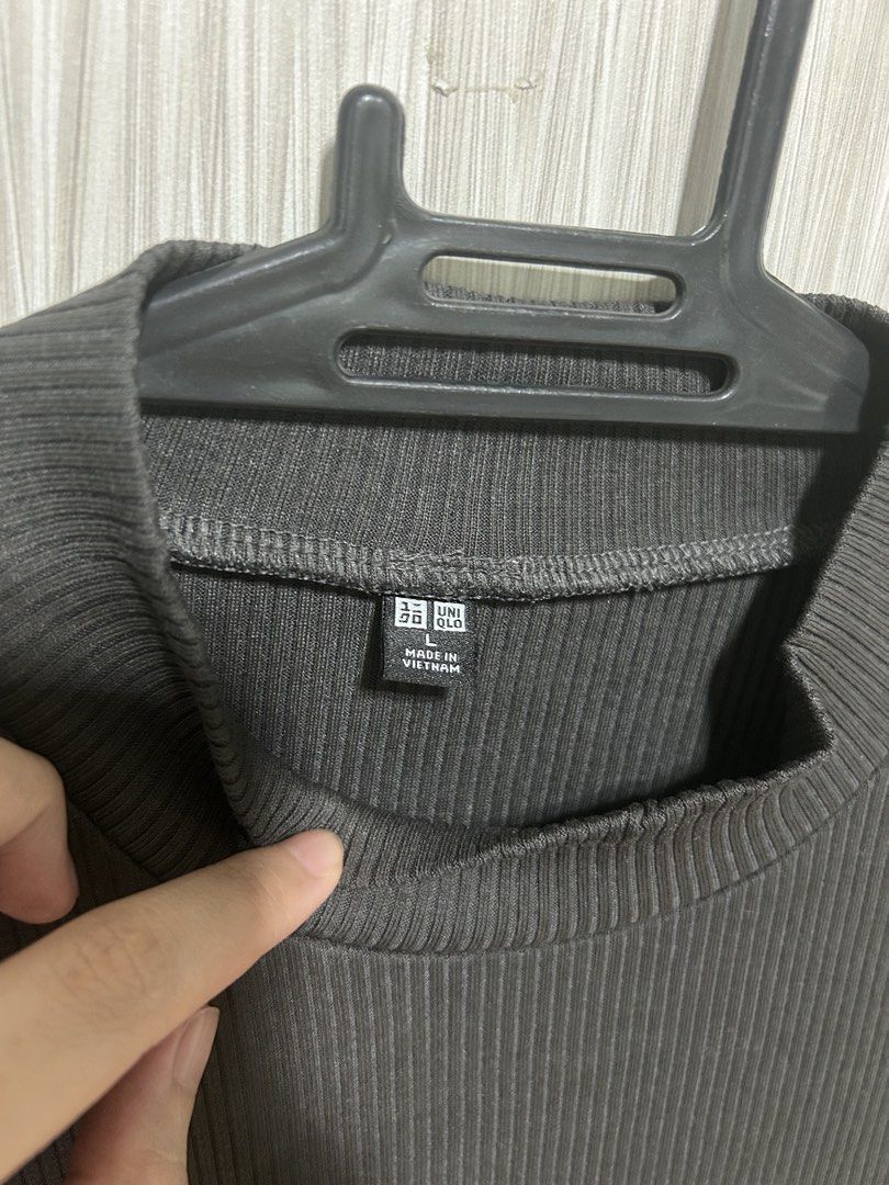 Uniqlo Ribbed Mock Neck Top (Category: Shirts) located in Manila. Submitted by juvy13 (Listing ID 1463015742, Image 2). Description: - Uniqlo Ribbed T-shirt - Mock neck style - Short sleeves - Dark grey color - Made in Vietnam - Comfortable and versatile - Perfect for layering or wearing solo.