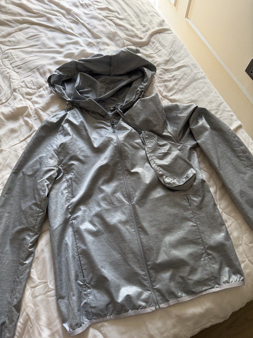 Uniqlo Silver Pocketable UV Protection Parka (Category: Coats, Jackets and Outerwear) located in Makati City. Submitted by angelinanicole (Listing ID 1462940611, Image 1). Description: - Uniqlo Hooded Jacket - Color: Silver - Lightweight and packable design - Zip-up front and convenient pockets - Easy to carry and travel with.