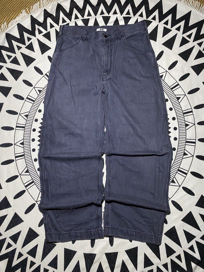 Uniqlo U Wide Fit Work Pants (Category: Trousers) located in Badiangan. Submitted by iralorana.thrift (Listing ID 1463022201, Image 1). Description: - Uniqlo U Wide Fit Work Pants - Color: Dark Grey/Navy - Silhouette: Relaxed, baggy, wide fit - Style: Classic workwear - Features: Durable stitching, 2 front pockets, 2 back pockets - Closure: Button and zip - Ideal for: Everyday wear.