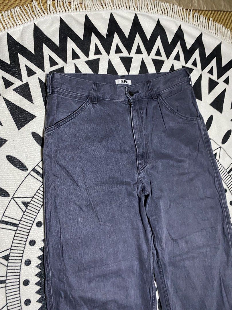 Uniqlo U Wide Fit Work Pants (Category: Trousers) located in Badiangan. Submitted by iralorana.thrift (Listing ID 1463022201, Image 2). Description: - Uniqlo U Wide Fit Work Pants - Color: Dark Grey/Navy - Silhouette: Relaxed, baggy, wide fit - Style: Classic workwear - Features: Durable stitching, 2 front pockets, 2 back pockets - Closure: Button and zip - Ideal for: Everyday wear.