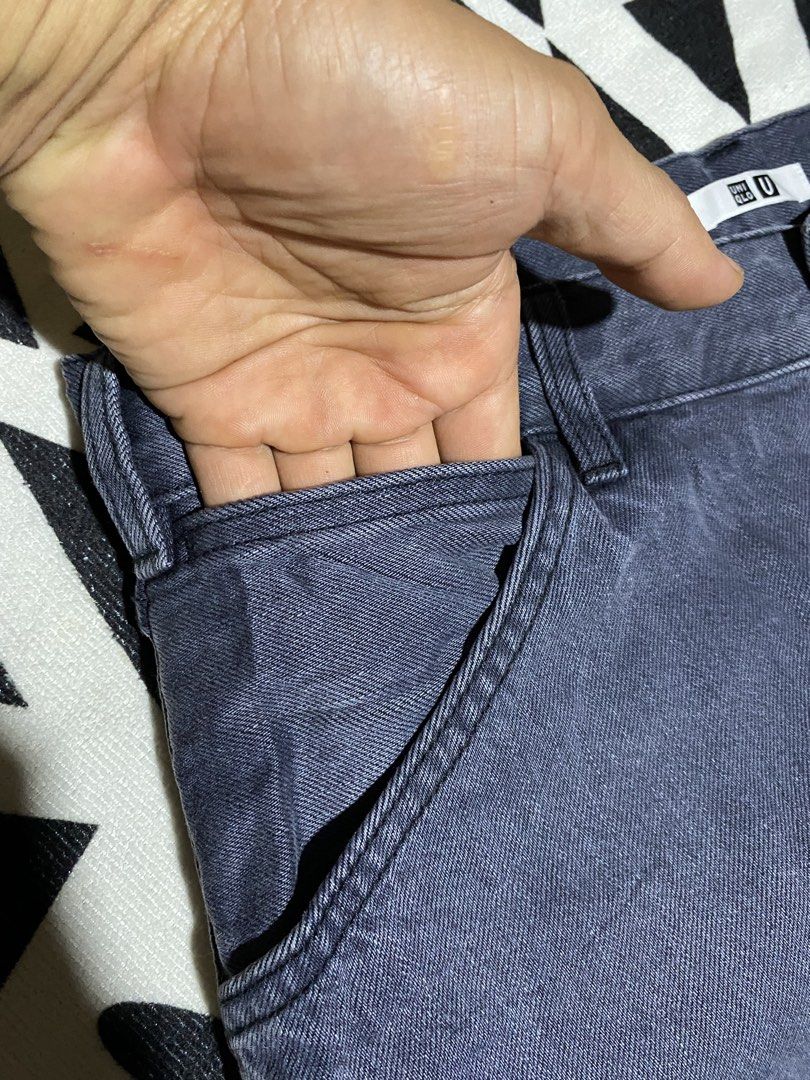 Uniqlo U Wide Fit Work Pants (Category: Trousers) located in Badiangan. Submitted by iralorana.thrift (Listing ID 1463022201, Image 3). Description: - Uniqlo U Wide Fit Work Pants - Color: Dark Grey/Navy - Silhouette: Relaxed, baggy, wide fit - Style: Classic workwear - Features: Durable stitching, 2 front pockets, 2 back pockets - Closure: Button and zip - Ideal for: Everyday wear.