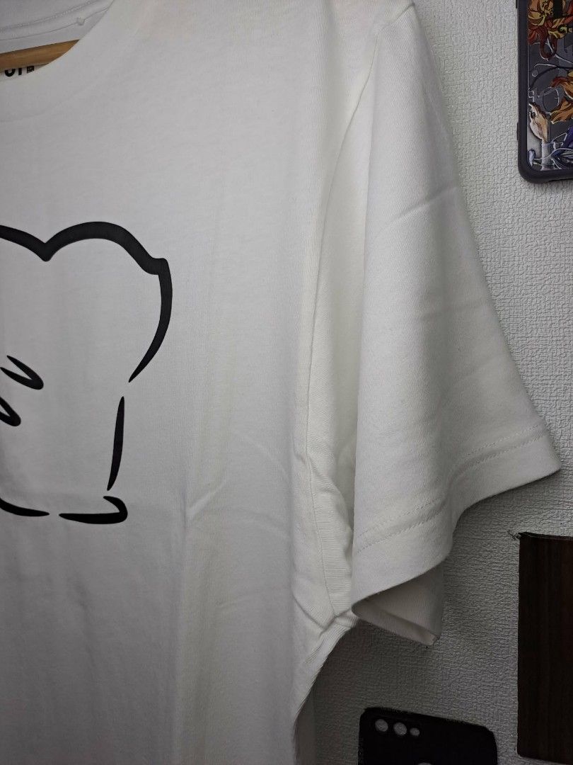 UT Uniqlo x Pikachu x Pokèmon (Category: Shirts) located in Manila. Submitted by yaseen__73 (Listing ID 1463058588, Image 2). Description: "With Pokémon" UT collection by UNIQLO. Released as part of a 2020 collaborative capsule, the shirt features a minimalist line-art design outlining the back silhouette of a female Pikachu (identifiable by the heart-shaped notch at the end of its lightning-bolt tail). - Small on Tag - Dimensions : See Photo - C