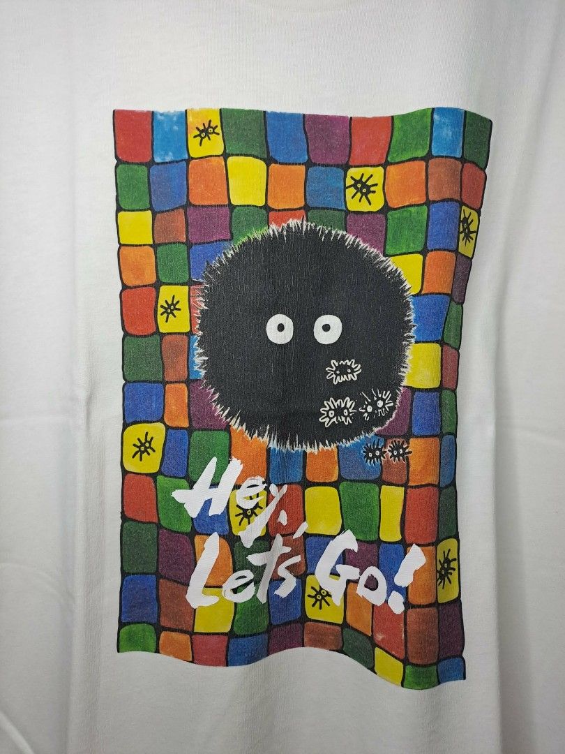 UT Uniqlo x Studio Ghibli (Category: Shirts) located in Manila. Submitted by yaseen__73 (Listing ID 1463048171, Image 3). Description: Uniqlo x Studio Ghibli Soot Sprite UT graphic t-shirt featuring a colorful geometric grid background and the phrase "Hey, Let's Go - Small on Tag - Dimensions : See Photo - Color Rate : 9.5/10 - Minor Marks of Usage - In Excellent Condition 250.00 Shipped MOP : J&T LA LA MOVE Seller's Location : 📍Brgy. Pansol, Q.