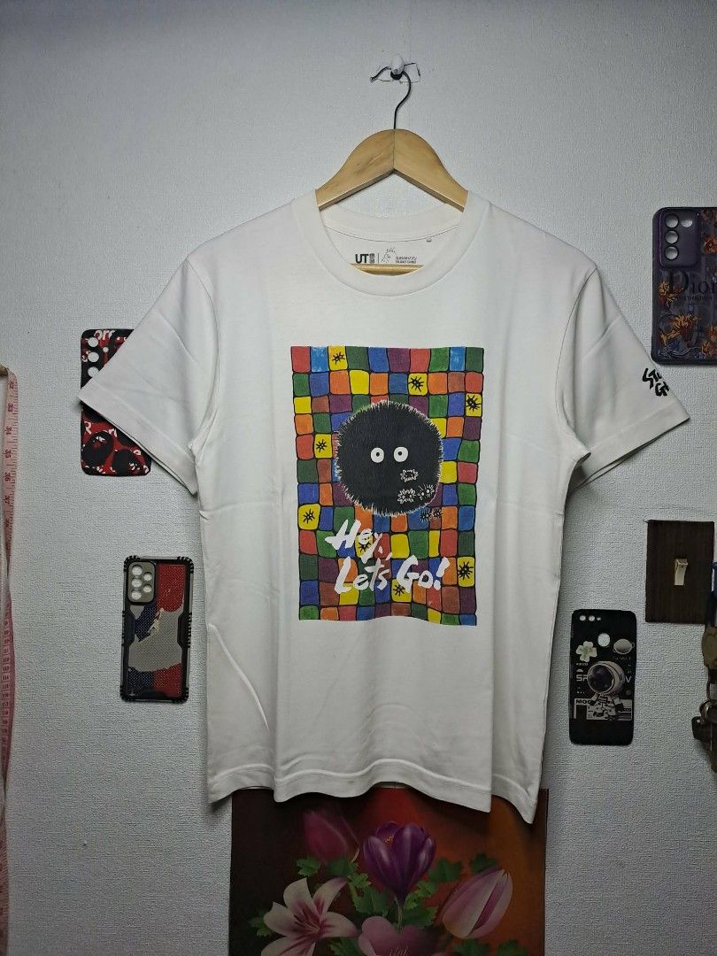 UT Uniqlo x Studio Ghibli (Category: Shirts) located in Manila. Submitted by yaseen__73 (Listing ID 1463048171, Image 1). Description: Uniqlo x Studio Ghibli Soot Sprite UT graphic t-shirt featuring a colorful geometric grid background and the phrase "Hey, Let's Go - Small on Tag - Dimensions : See Photo - Color Rate : 9.5/10 - Minor Marks of Usage - In Excellent Condition 250.00 Shipped MOP : J&T LA LA MOVE Seller's Location : 📍Brgy. Pansol, Q.