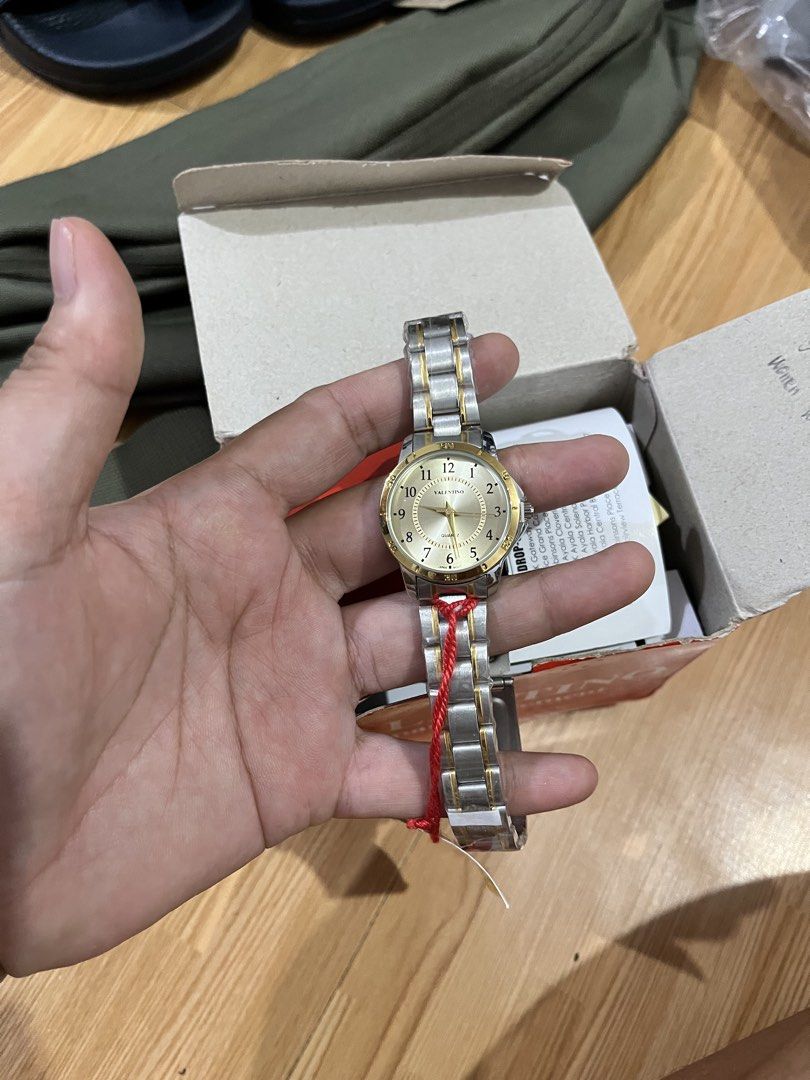Valentino Two-Tone Watch (Category: Women's Watches) located in Cebu City. Submitted by maryjoyieeflores (Listing ID 1463047013, Image 2). Description: - Authentic Valentino watch - Elegant two-tone stainless steel band - Sophisticated gold dial with silver hour markers - Timeless, classic design - Comes with original box and tags - Versatile for everyday wear or special events.
