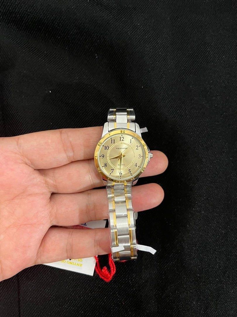 Valentino Two-Tone Watch (Category: Women's Watches) located in Cebu City. Submitted by maryjoyieeflores (Listing ID 1463047013, Image 1). Description: - Authentic Valentino watch - Elegant two-tone stainless steel band - Sophisticated gold dial with silver hour markers - Timeless, classic design - Comes with original box and tags - Versatile for everyday wear or special events.