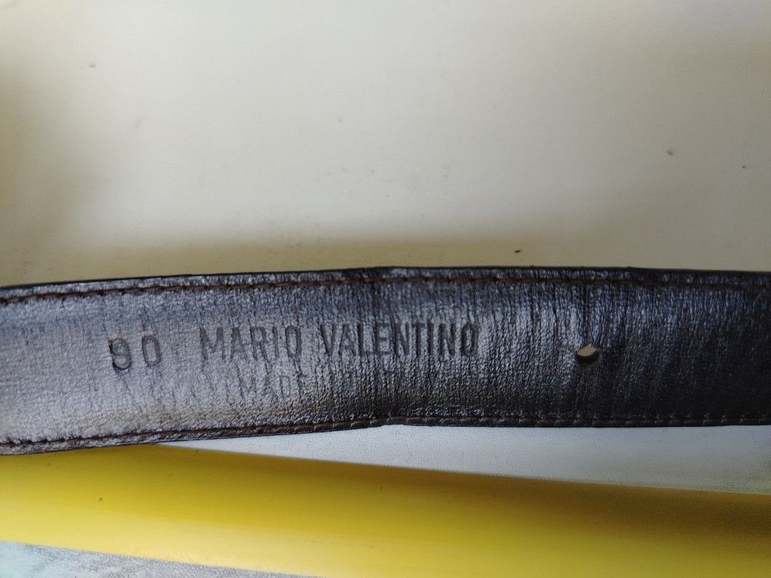 Valentino vintage leather belt (Category: Luxury Accessories) located in Manila. Submitted by rockandrolly (Listing ID 1462981177, Image 2). Description: Brand: Mario Valentino Size: 90 (fits waist approx 32–35") Material: Smooth black genuine leather Buckle: Polished gold-tone with engraved "Valentino" signature & triangular accent Origin: Made in Italy Condition: Pre-loved ✅ - Leather strap solid — no cracks, tears, or heavy wear ​unisex - Buck