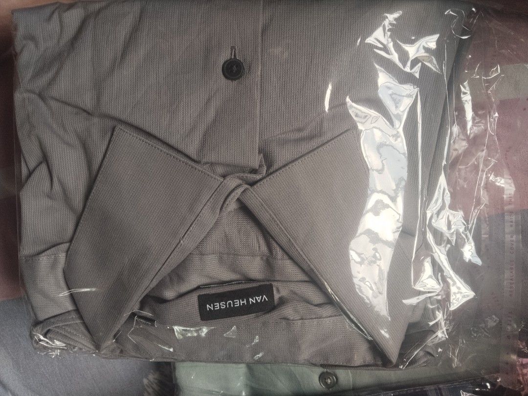 Van Heusen Grey Button-Up long sleeve (Category: Tshirts & Polo Shirts ) located in Manila. Submitted by juanayesha1713 (Listing ID 1462965990, Image 1). Description: - Brand: Van Heusen - Color: Grey - Style: Button-up shirt (casual/smart-casual) - Features: Subtle ribbed texture - Condition: New in original packaging - Ideal for: Everyday wear, dressing up slightly.