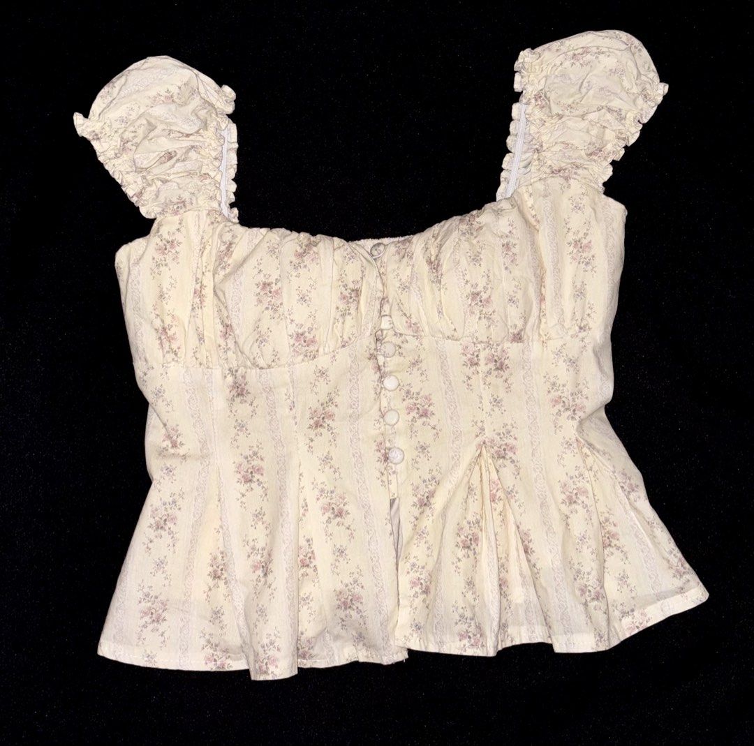 Padded Cream Floral Buttoned Top (Category: Others Tops) located in Manila. Submitted by itslala_ (Listing ID 1463005351, Image 1). Description: -Size: M (sizing are small) -Color: Cream -Pattern: Floral -Newly bought. Never been worn. -Ruffle sleeves .