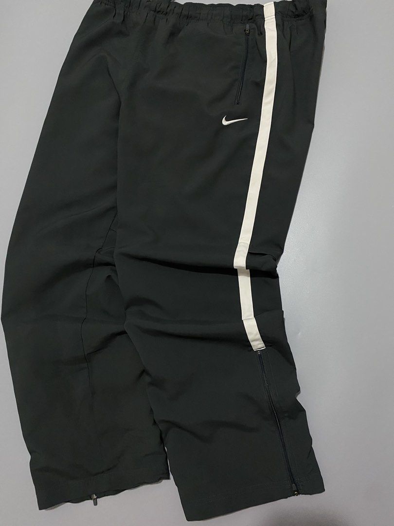 Vinatge Nike Dri-Fit Track Pants (Category: Joggers) located in Manila. Submitted by urboycee (Listing ID 1463091641, Image 3). Description: - Nike Dri-Fit track pants - Color: Black with white stripe detail - Size: XXL - Features: Elastic waistband with drawstring, ankle zippers, two front pockets - Origin: Made in China.
