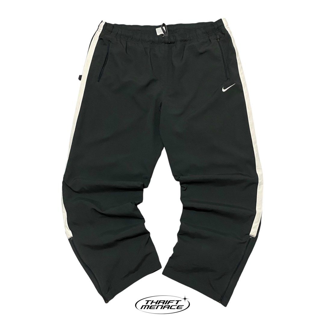 Vinatge Nike Dri-Fit Track Pants (Category: Joggers) located in Manila. Submitted by urboycee (Listing ID 1463091641, Image 1). Description: - Nike Dri-Fit track pants - Color: Black with white stripe detail - Size: XXL - Features: Elastic waistband with drawstring, ankle zippers, two front pockets - Origin: Made in China.