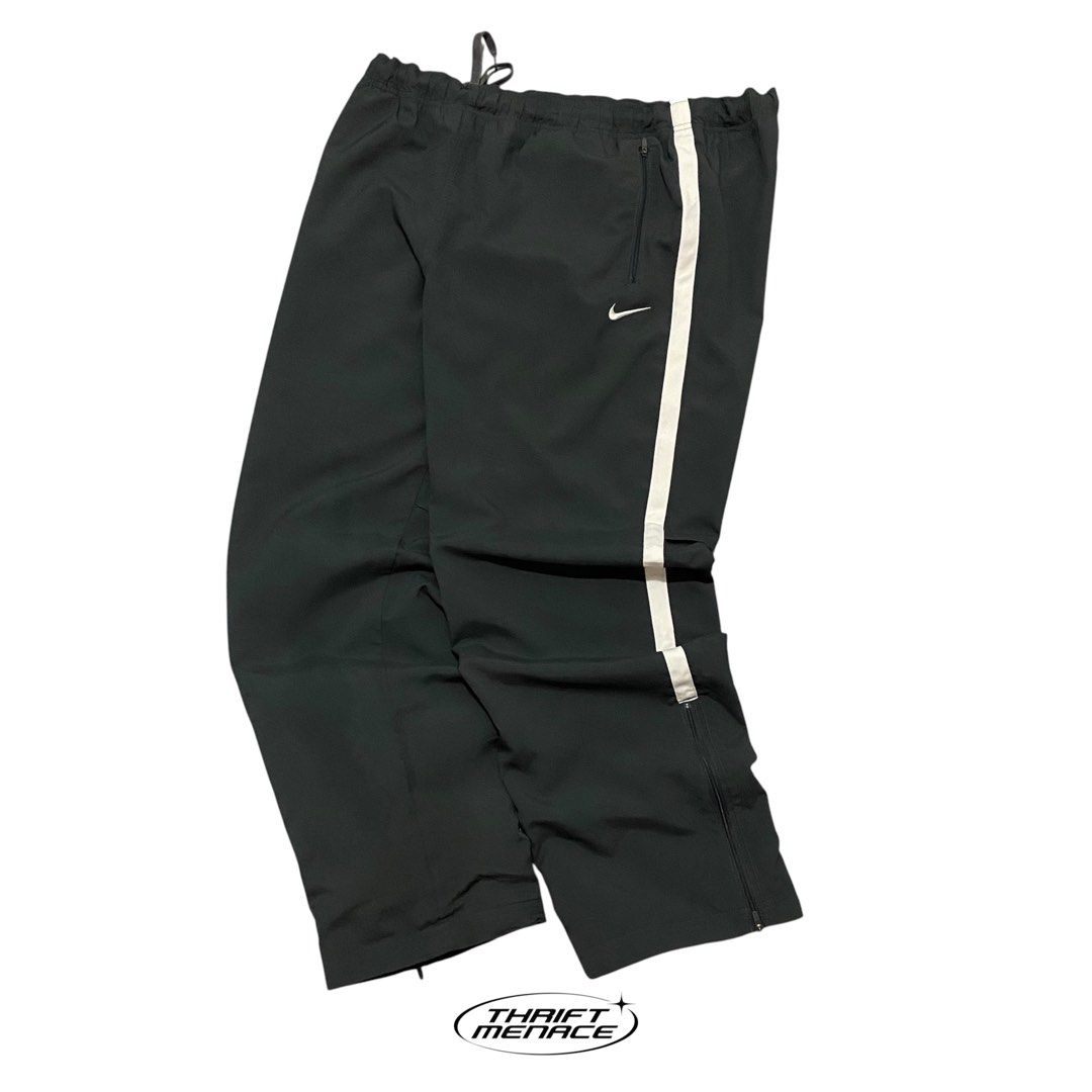 Vinatge Nike Dri-Fit Track Pants (Category: Joggers) located in Manila. Submitted by urboycee (Listing ID 1463091641, Image 2). Description: - Nike Dri-Fit track pants - Color: Black with white stripe detail - Size: XXL - Features: Elastic waistband with drawstring, ankle zippers, two front pockets - Origin: Made in China.