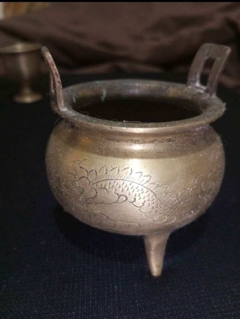 Vintage Chinese Brass Censer (Category: Vintage Collectibles) located in Baguio. Submitted by silentturtle.5ec778 (Listing ID 1462998062, Image 3). Description: This brass censer features a classic tripod design and is adorned with a peach motif, symbolizing longevity and prosperity in Chinese culture. Such censers were historically used in religious ceremonies and domestic settings to burn incense. The craftsmanship, while not exceptionally refi