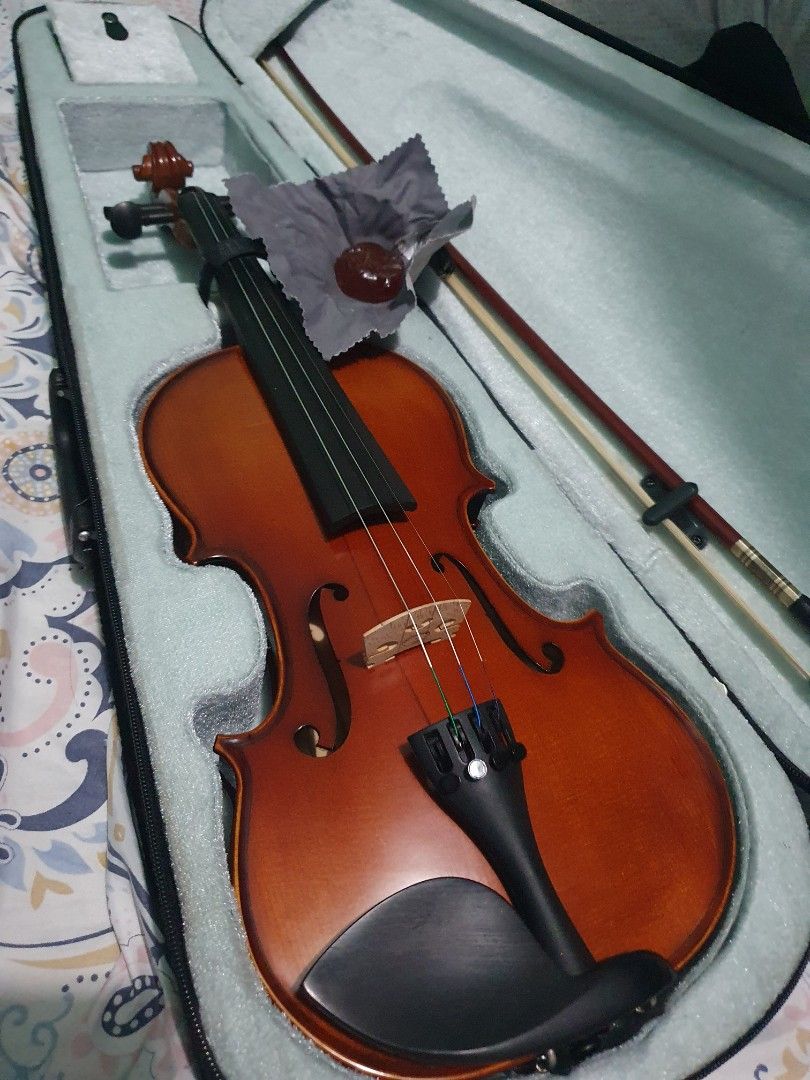 Violin with Case and Bow (Category: Musical Instruments) located in Manila. Submitted by magaoaymar91391 (Listing ID 1463059067, Image 1). Description: Selling a complete student violin setup originally purchased from The String Department for ₱10,000. Overall in great structural condition, but needs a new set of strings as the G (lowest) string recently snapped. Price has been adjusted down to account for the replacement set. ​Price: ₱8,500 (Neg
